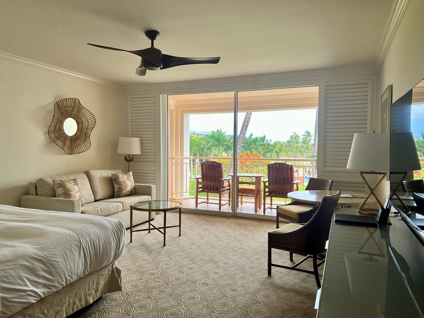 Guest room with bed and sitting area at Grand Wailea