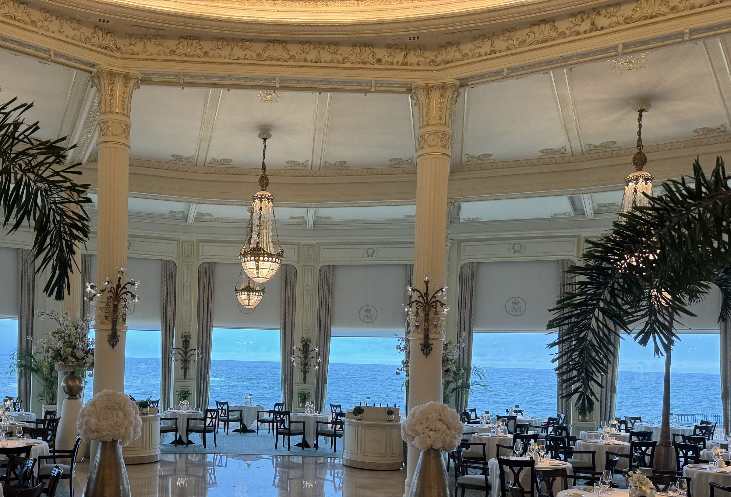 Ornate dining room and Atlantic-facing windows at Hôtel du Palais
