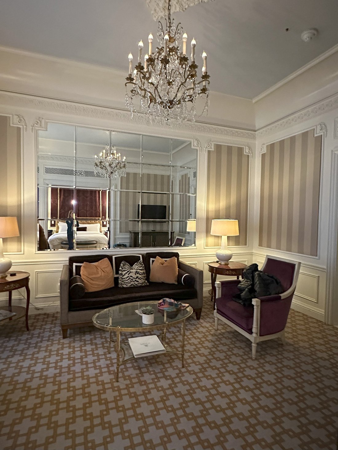 Suite sitting room and chandelier at The St. Regis New York